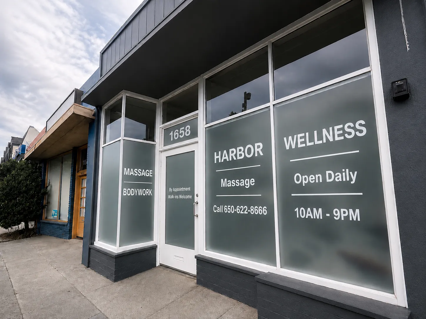 Harbor Wellness Massage storefront on El Camino Real in San Carlos, window signage reading Open Daily 10AM-9PM