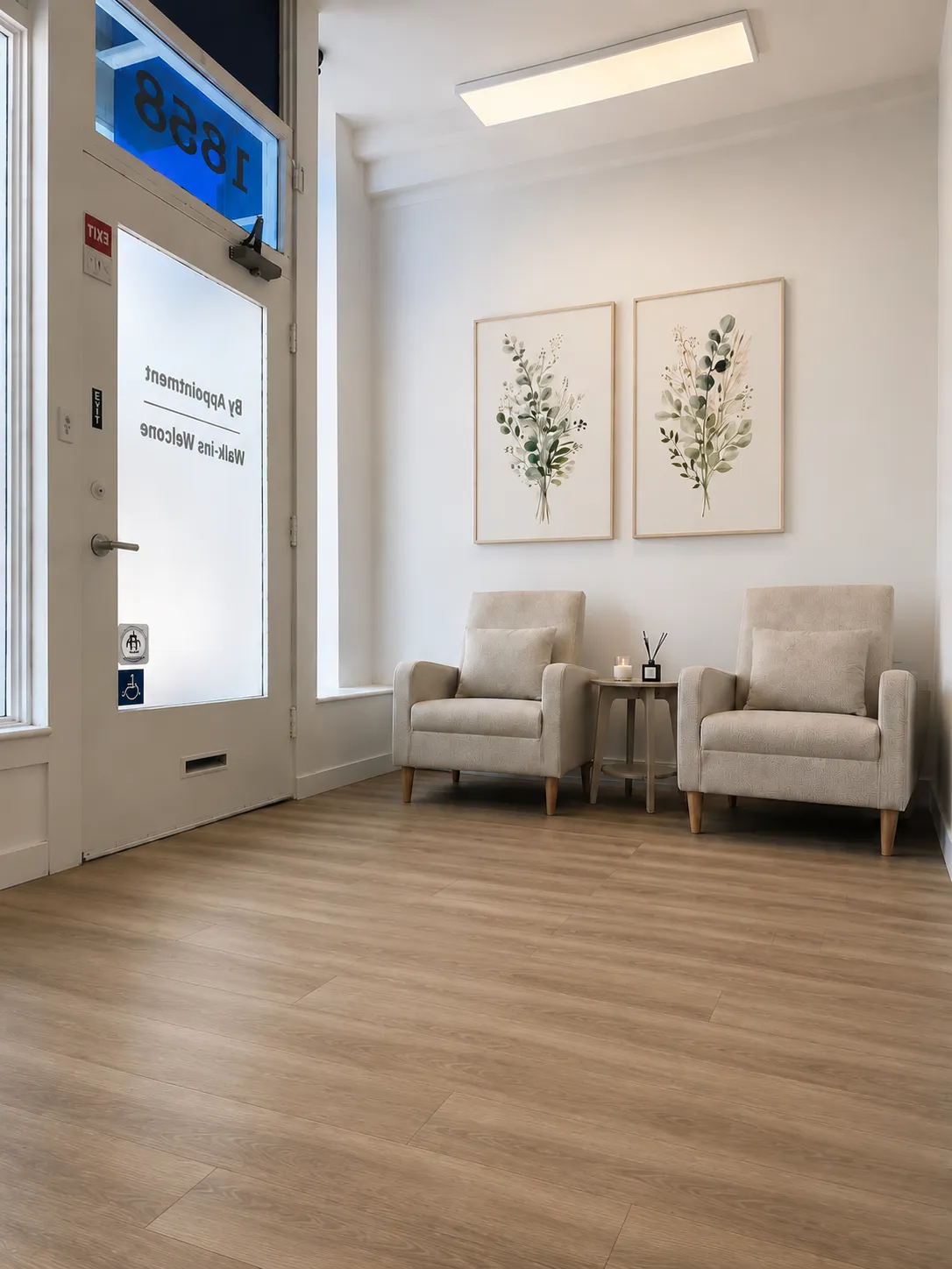 Armchairs and botanical prints in the calm waiting area at Harbor Wellness San Carlos